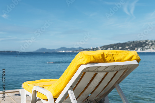 Empty yellow beach lounge overlooking the Mediterranean Sea in Juan les Pins  France