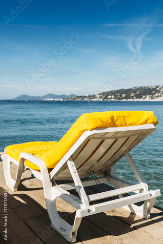 Empty yellow beach lounge overlooking the Mediterranean Sea in Juan les Pins  France