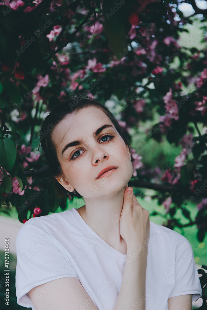 Girl near blossoming tree. Girl near blossoming tree.