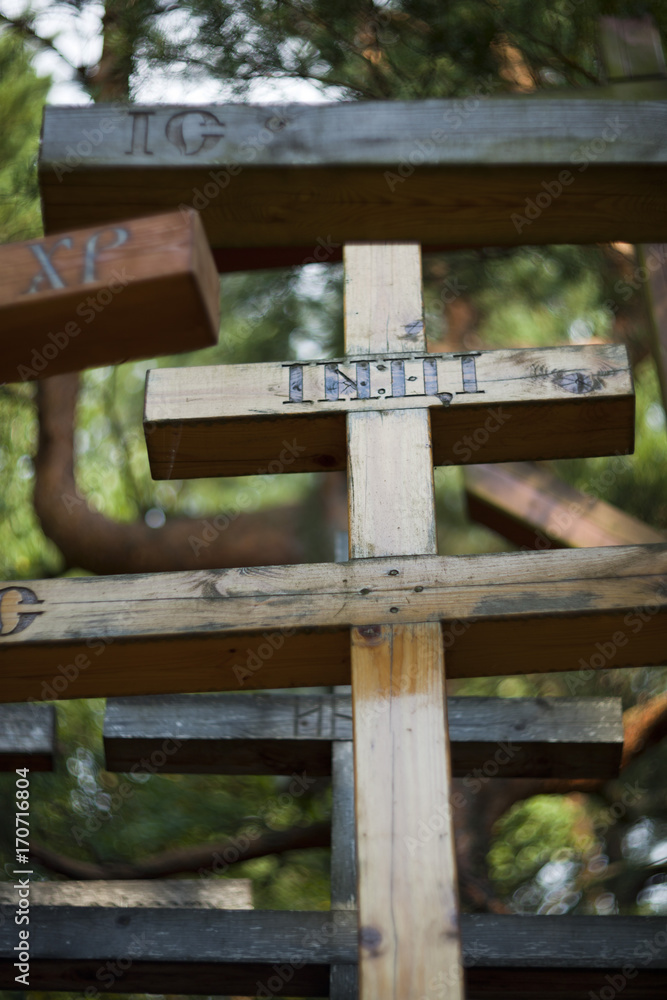 Grabarka, Poland - August 12, 2017: Orthodox crosses brought by pilgrims to the Holy Mount of Grabarka. Podlaskie Voivodeship. Polish Orthodox pilgrimage center. Grabarka, Poland - August 12, 2017: Orthodox crosses brought by pilgrims to the Holy Mount of Grabarka. Podlaskie Voivodeship. Polish Orthodox pilgrimage center.