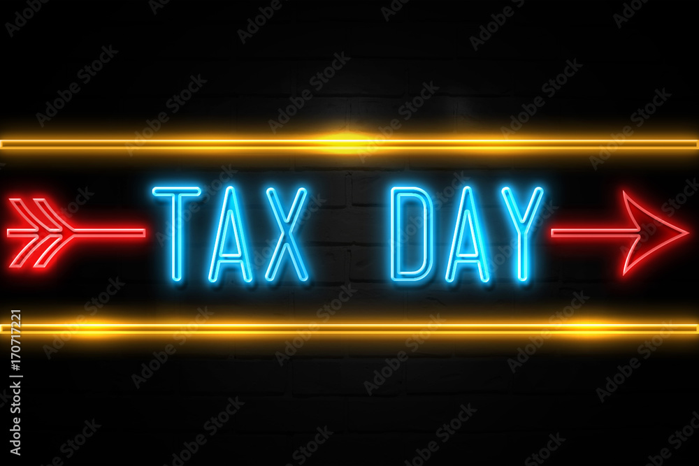 Tax Day - fluorescent Neon Sign on brickwall Front view Tax Day - fluorescent Neon Sign on brickwall Front view