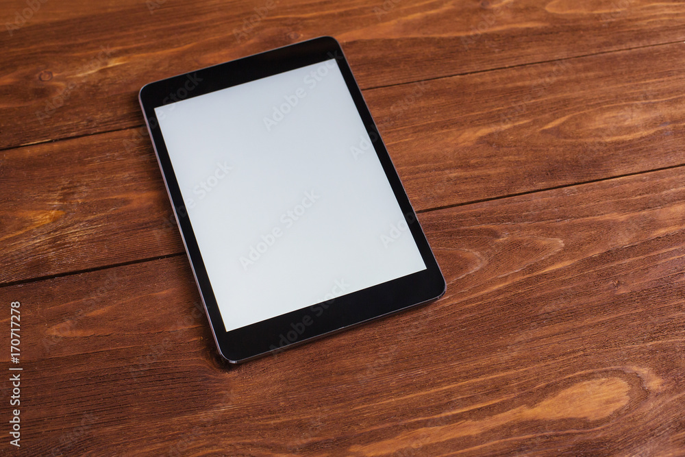 office concept tablet pc on wooden table background office concept tablet pc on wooden table background