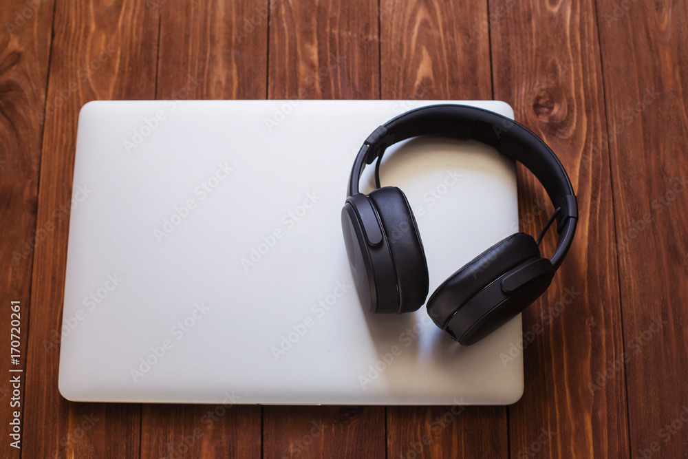 desk table laptop headphones music or office concept wooden background table top view copy space desk table laptop headphones music or office concept wooden background table top view copy space