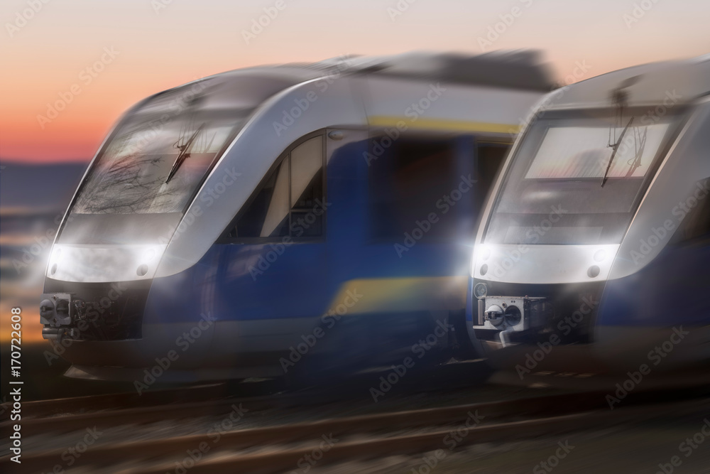 two trains speeding in a sunset