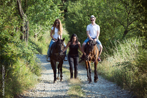 Friends Horseback Riding in the Countryside