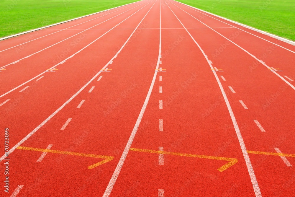 red running track on athletic stadium