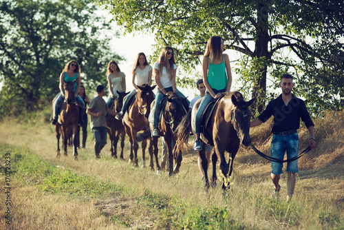 Friends Horseback Riding in the Countryside © romul014