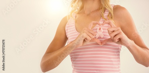 Wallpaper Mural Mid section of young woman making heart shape with hands over Torontodigital.ca
