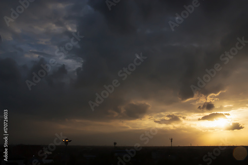 Dramatic panorama view and Silhouette of sunset golden sky at suburb area on twilight time.