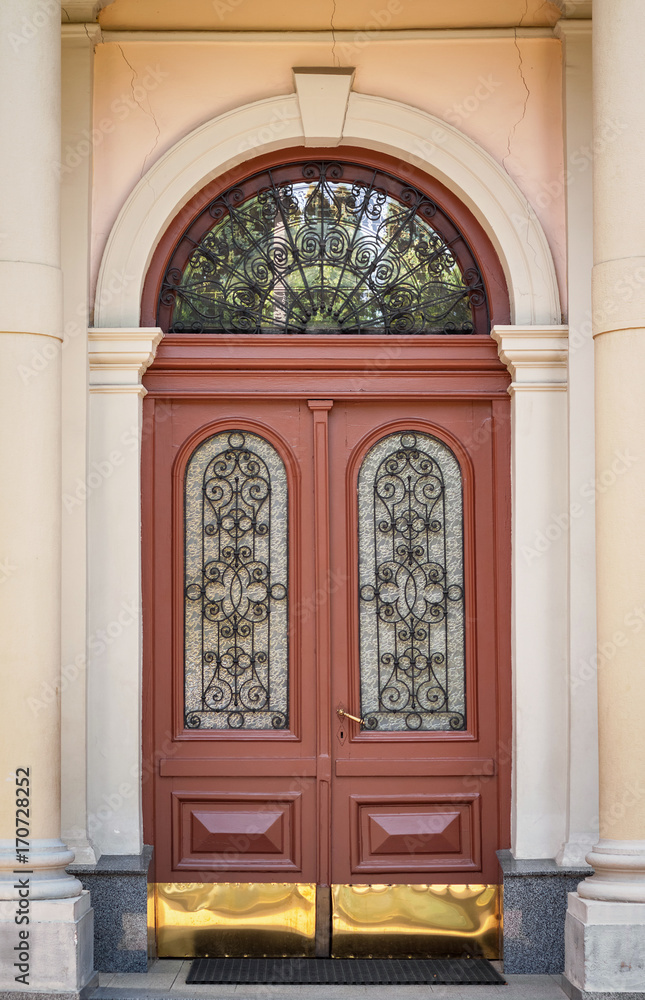 The door of the old European building. Exterior design element of ancient Lvov. Example of world architectural heritage.