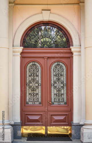 The door of the old European building. Exterior design element of ancient Lvov. Example of world architectural heritage. © 621513