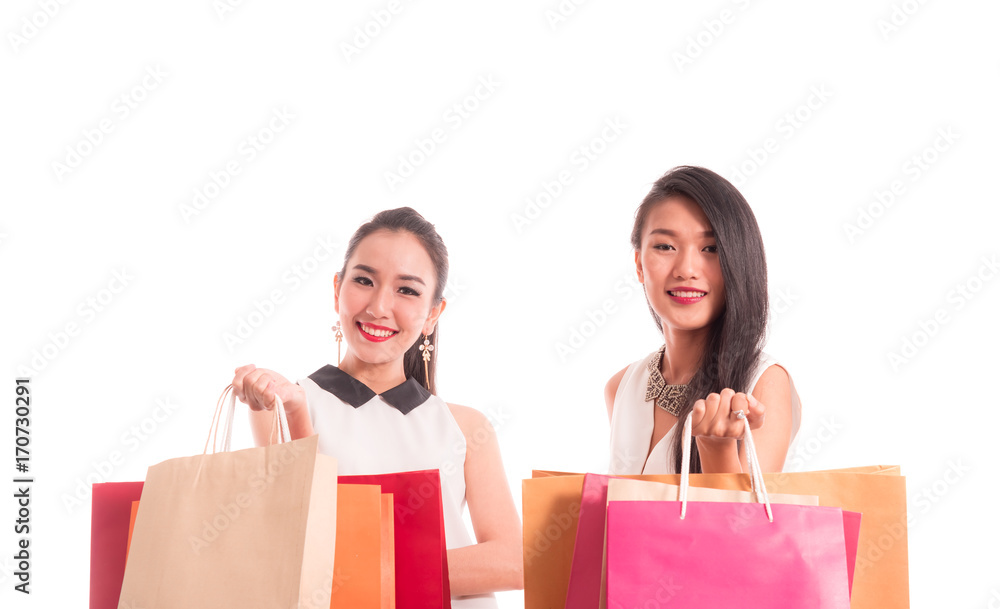 Group of Cheerful shopping woman of Asian holding bags. Shopping smart business woman happy smiling holding colorful shopping bags isolated on white . Fresh young Asian female model Group of Cheerful shopping woman of Asian holding bags. Shopping smart business woman happy smiling holding colorful shopping bags isolated on white . Fresh young Asian female model