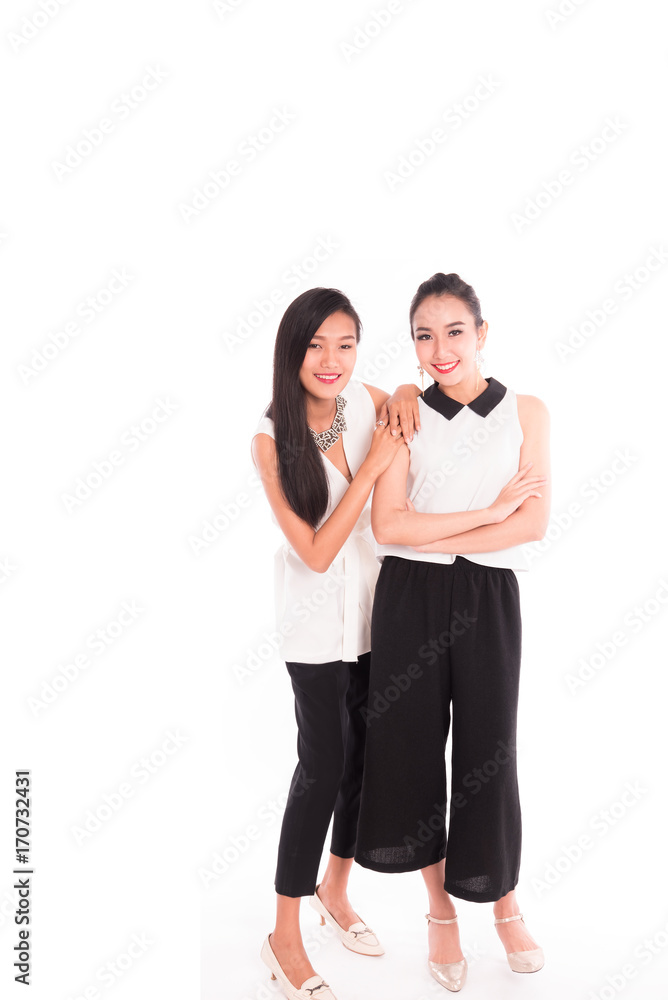 portrait of two attractive asian smiling women isolated on white studio portrait of two attractive asian smiling women isolated on white studio