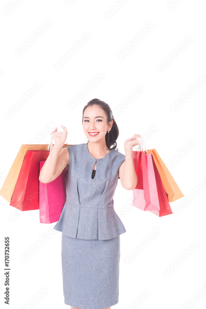 Cheerful shopping woman of Asian holding bags. Shopping smart business woman happy smiling holding colorful shopping bags isolated on white . Fresh young Asian female model Cheerful shopping woman of Asian holding bags. Shopping smart business woman happy smiling holding colorful shopping bags isolated on white . Fresh young Asian female model
