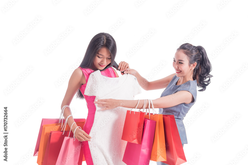 Group of friends Women choosing clothes together isolated white background ,shopping and fashion concept Group of friends Women choosing clothes together isolated white background ,shopping and fashion concept