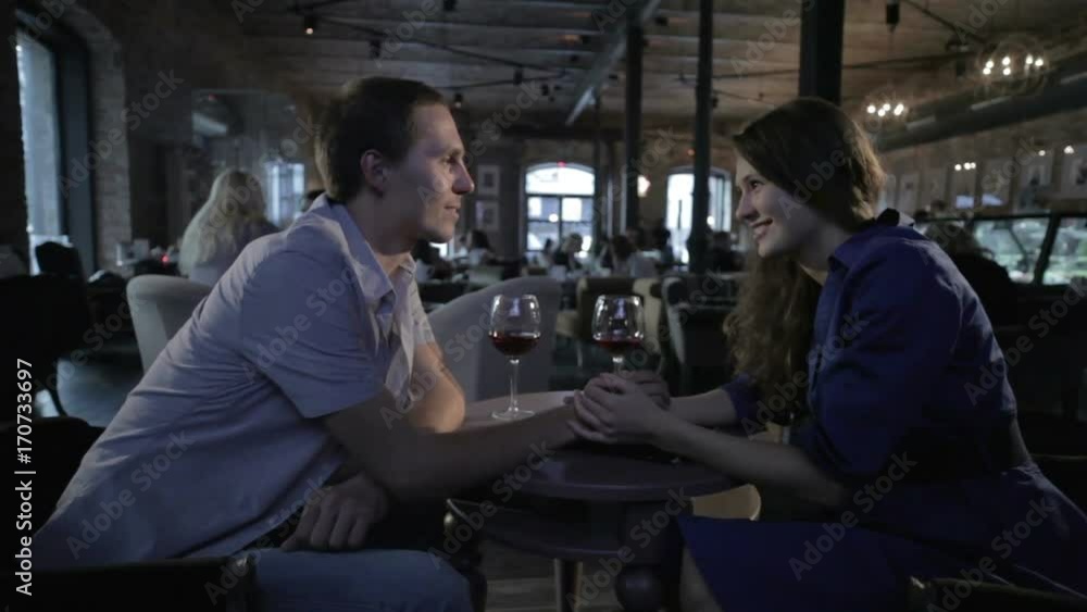 Girl and a guy in a restaurant Girl and a guy in a restaurant