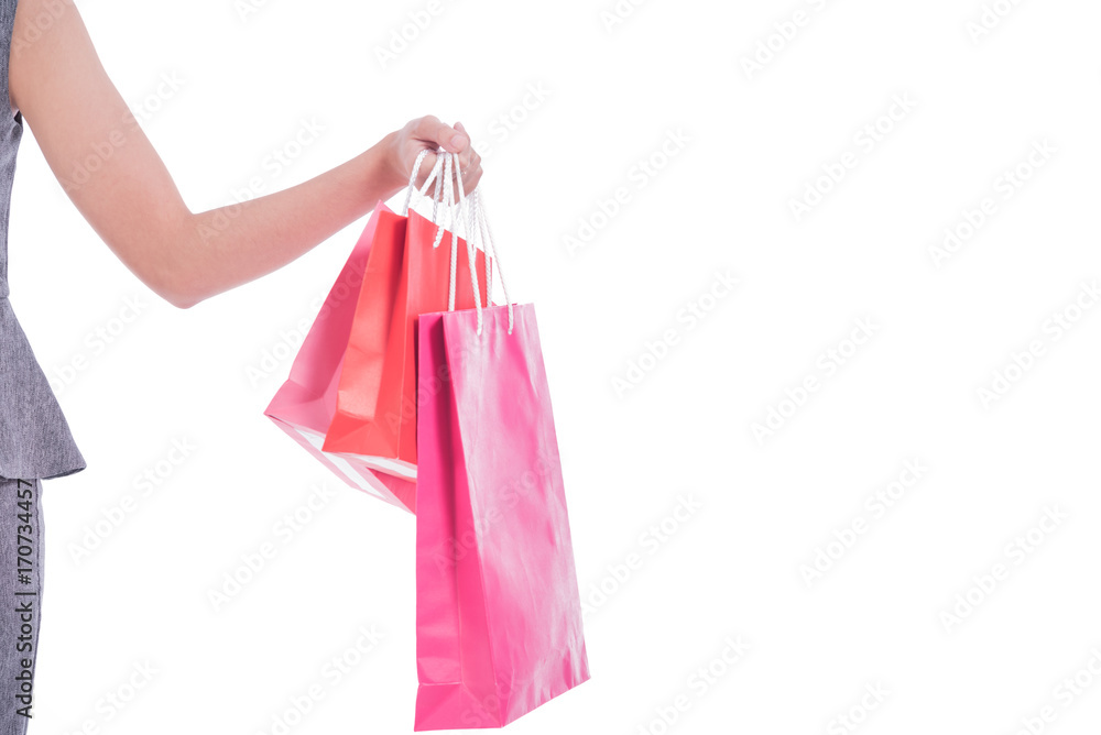 Closed up ,Hand of business women carrying colorful shopping bags isolated on white background