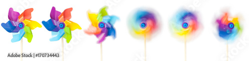 Colorful paper windmill in different rotate motion isolated on white
