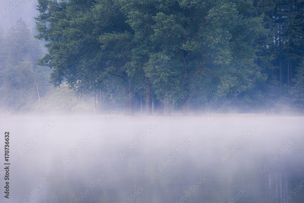 Fototapeta premium Lake at foggy morning misty weather