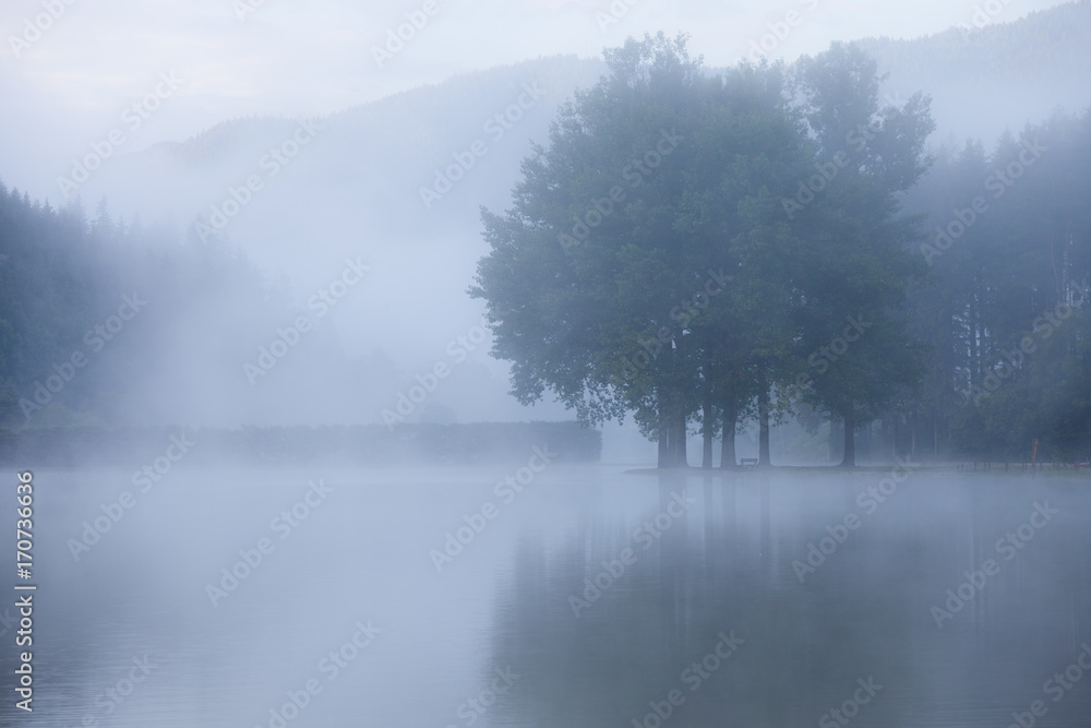 Lake at foggy morning misty weather Lake at foggy morning misty weather