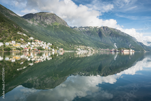Odda Town with small houses on a Fjord in Summer, Norway