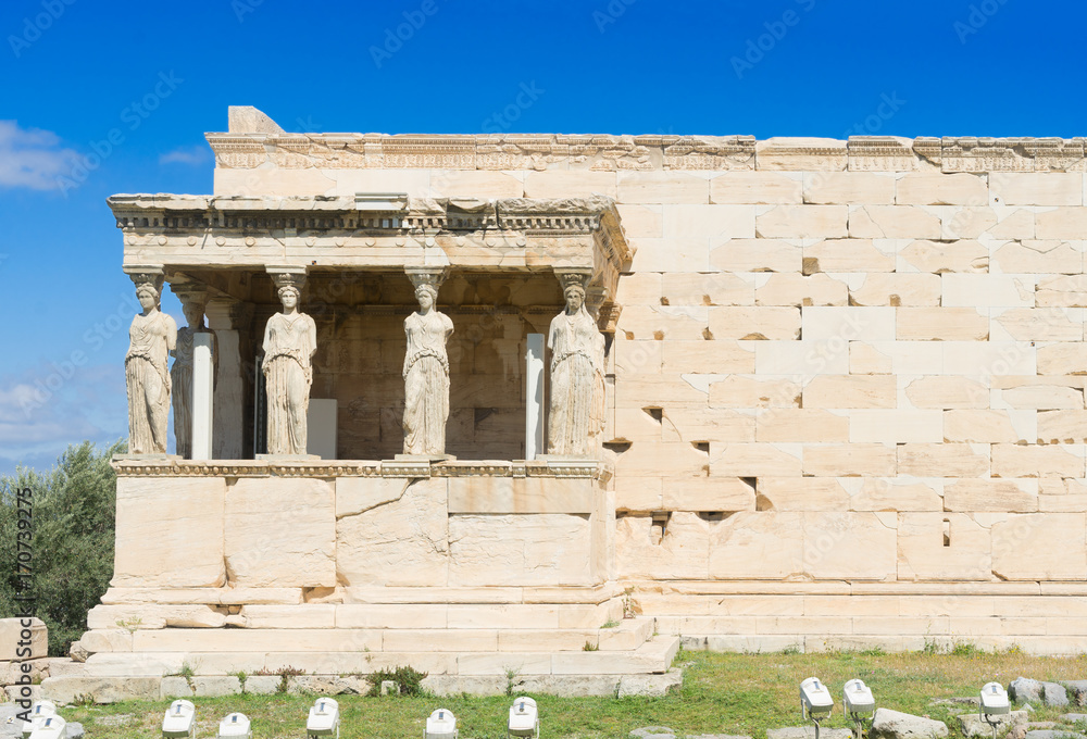 famous facade of Erechtheion temple in Acropolis of Athens, Greece