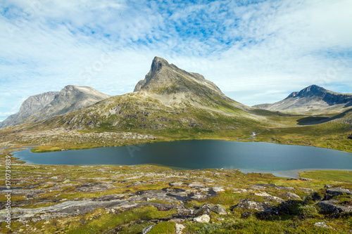 Panorama of summer landscape in Norway - river, stones, mountings