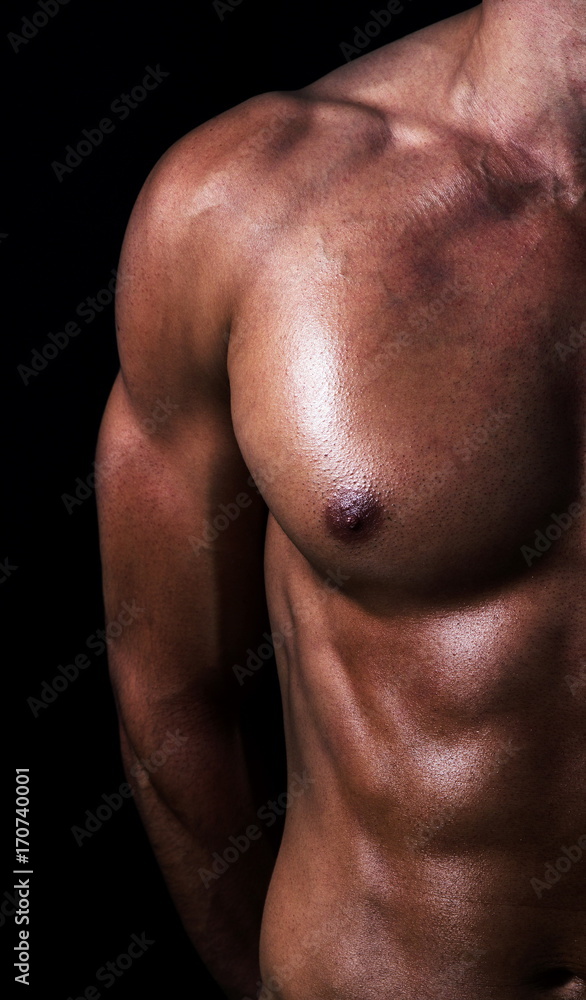 shape of sporty male body on dark