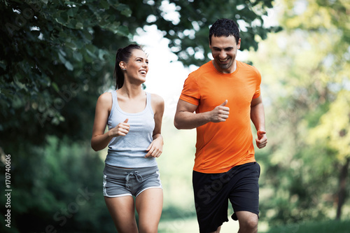 Happy couple running and jogging together
