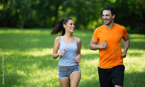Happy couple running and jogging together
