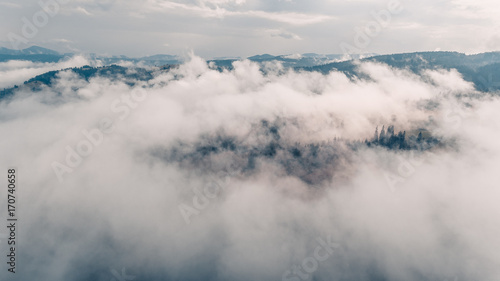 amazing view of mountains in the morning mist. aerial photography