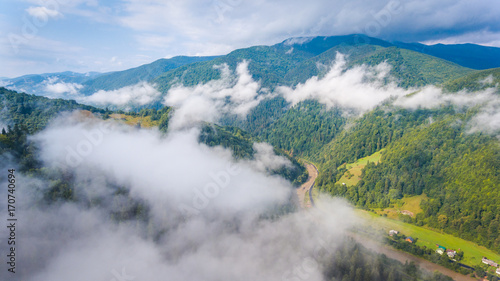 village at mountains in the morning mist. aerial photography