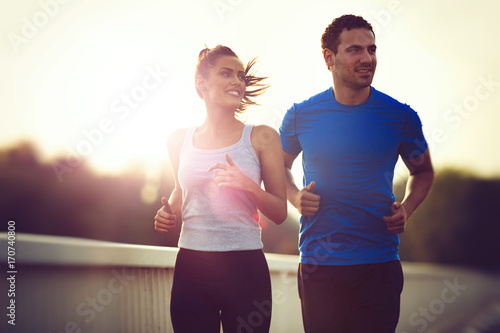 Beautiful sporty couple running and jogging