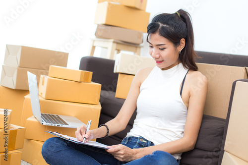 Young Asian Woman Working at home, Young Owner Woman Strat up for Business Online, SME, Delivery Project, Woman with Online Business or SME Concept.