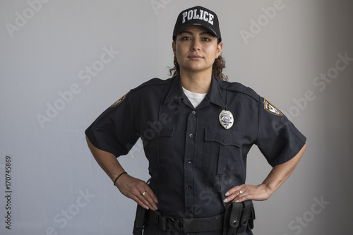 Fototapeta Portrait of a Hispanic female police officer
