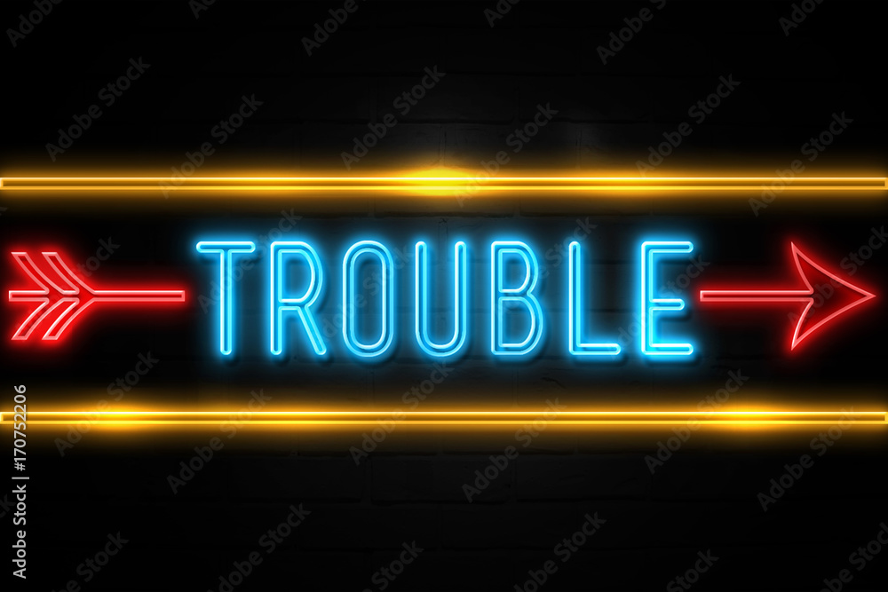 Trouble  - fluorescent Neon Sign on brickwall Front view