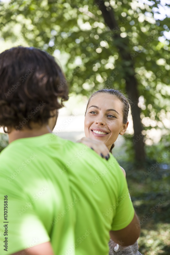 Young couple having exercise in the park