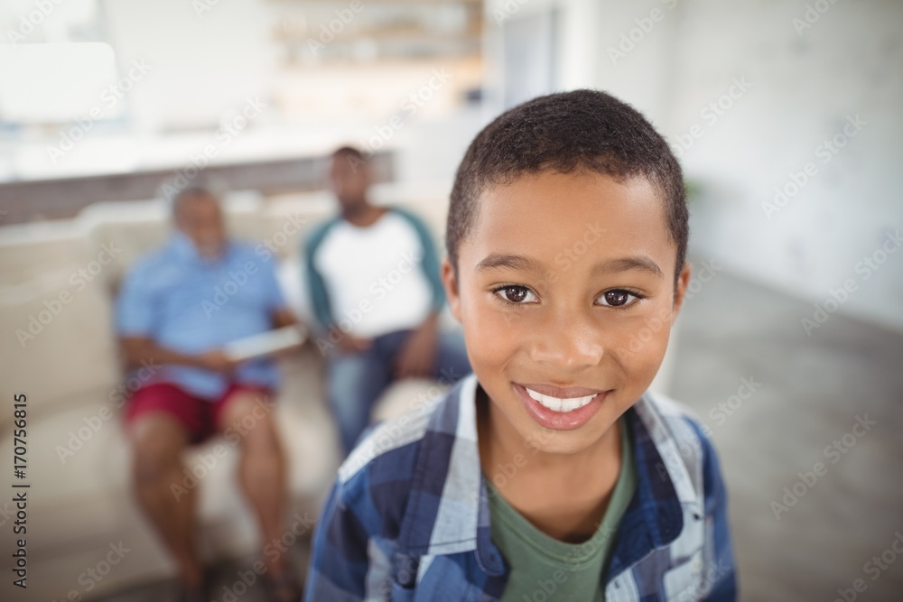 Smiling boy standing in living room Smiling boy standing in living room