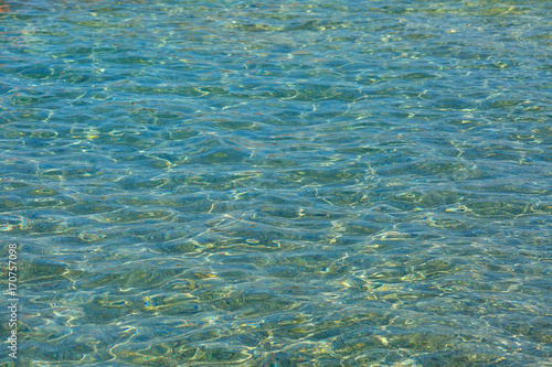 Beautiful turquoise relaxing calm sea background with sunlight reflection effect