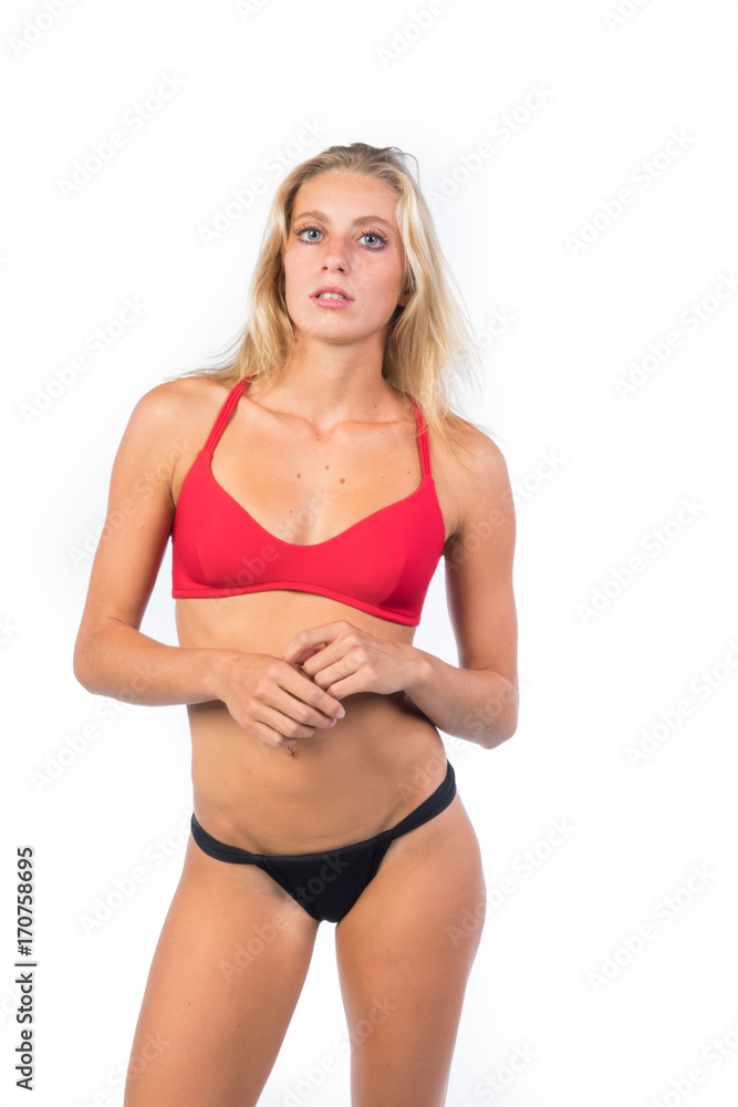 Fototapeta premium stupendous girl young blonde, in bikini on white background ,perfect body 
