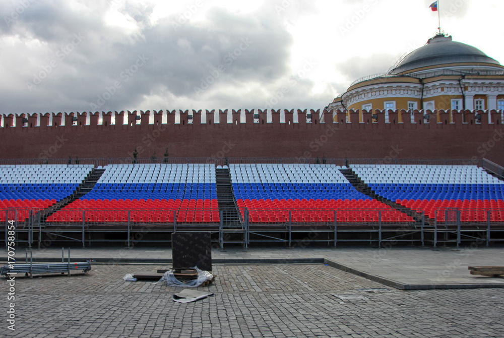 Stands in colors of russian flag on red square in Moscow near Kremlin wall