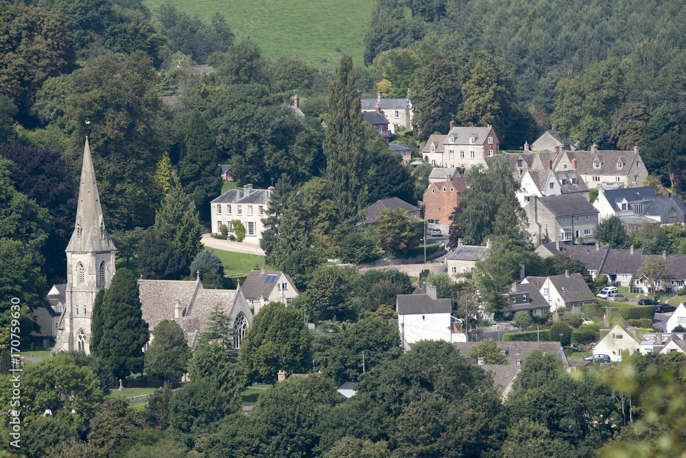 An overview of Woodchester and St Marys Church from Amberley Gloucestershire England UK over the Nailsworth Valley. August 2017