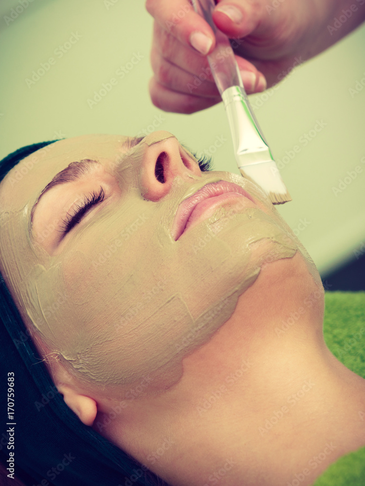 Woman having algae mud mask on face Woman having algae mud mask on face
