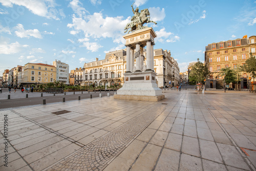 Obraz na plátne View on the Jaude square with statue during the sunset in Clermont-Ferrand city