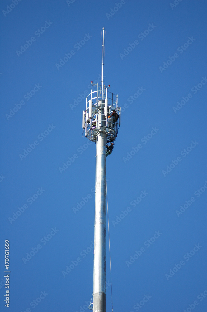 workers on a telecommunication tower