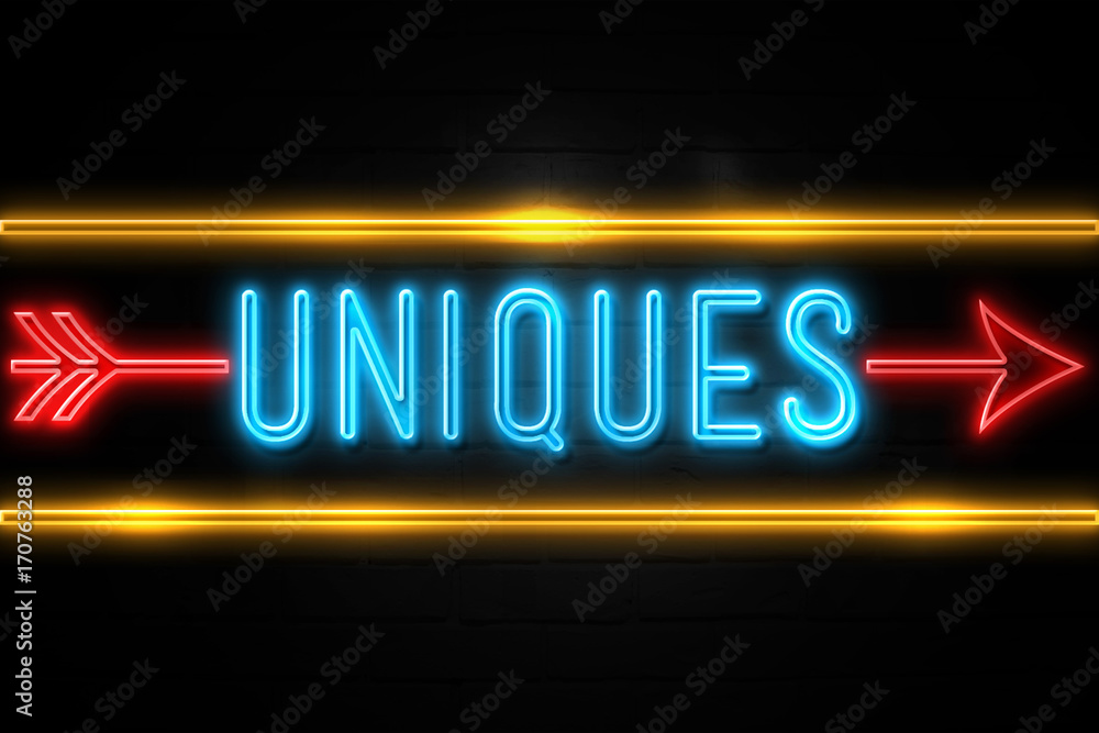 Uniques - fluorescent Neon Sign on brickwall Front view Uniques - fluorescent Neon Sign on brickwall Front view