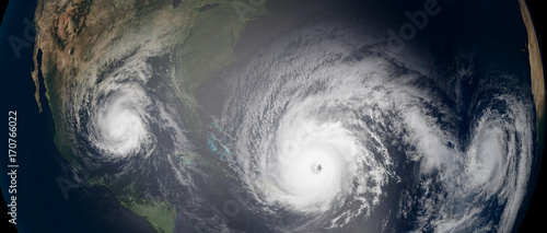 Fototapeta Naklejka Na Ścianę i Meble -  Extremely detailed and realistic high resolution 3d illustration of 3 hurricanes approaching the Caribbean Islands and Florida. Shot from Space. Elements of this image are furnished by Nasa.