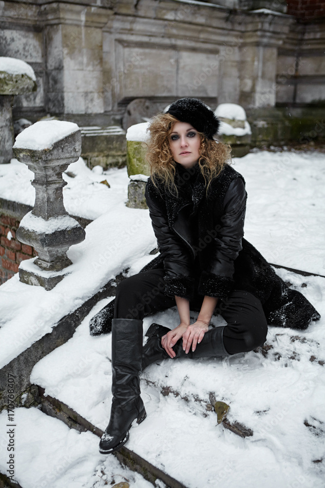 female in black clothes in winter outdoors. russian winter Stock