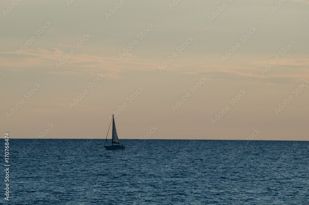 Sailboat at sunset on the Adriatic sea