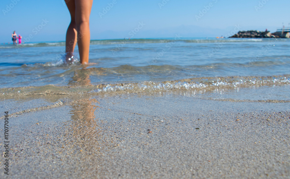 Girls Naked Bare Legs Standing In Crystal Clear Water On The Beach On A 